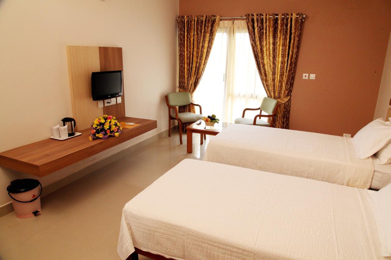Hotel Polariz Parassinikkadavu Habitación foto